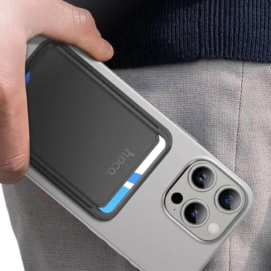 Person holding a phone with a Hoco Magnetic MagSafe Wallet attached on the back